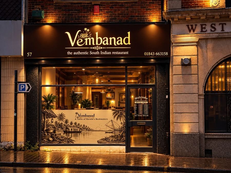 Vembanad restaurant storefront at night